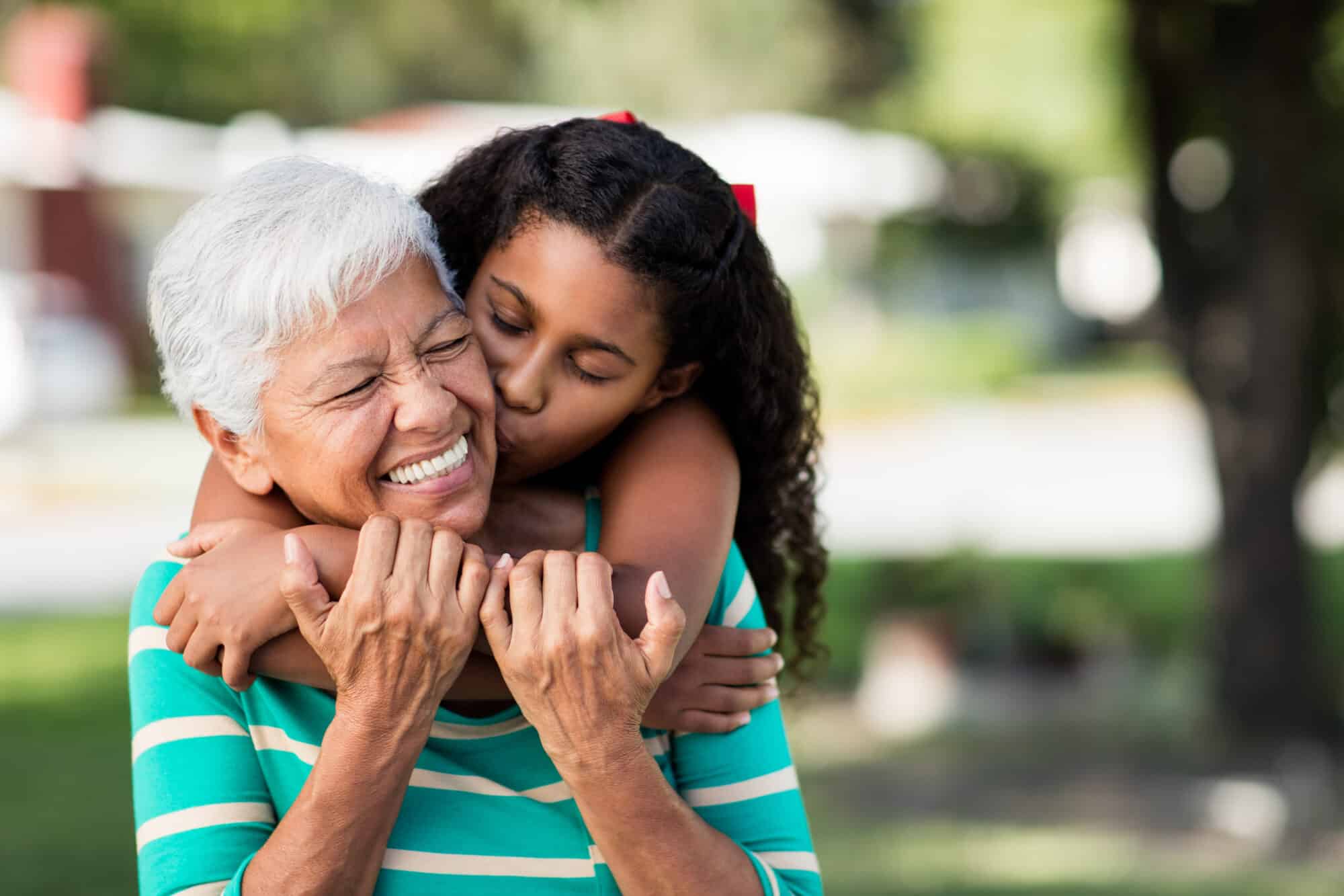 Girl hugging grandmother