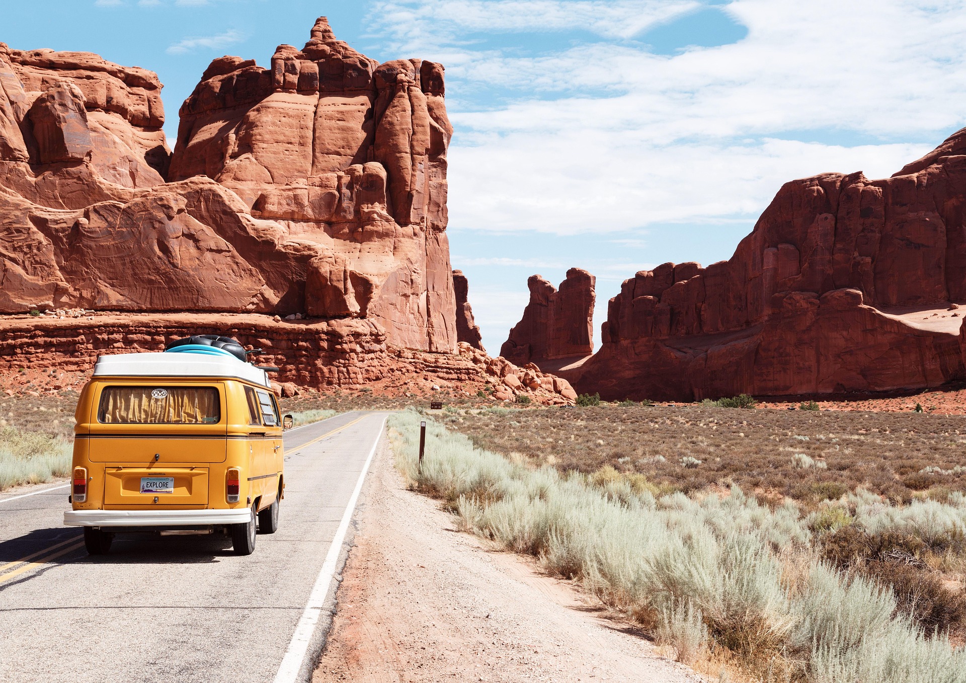 Orange van driving through Arches National Park