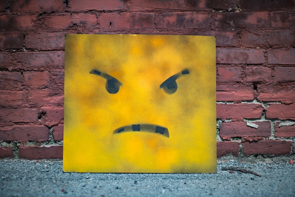 Angry cartoon character against brick wall